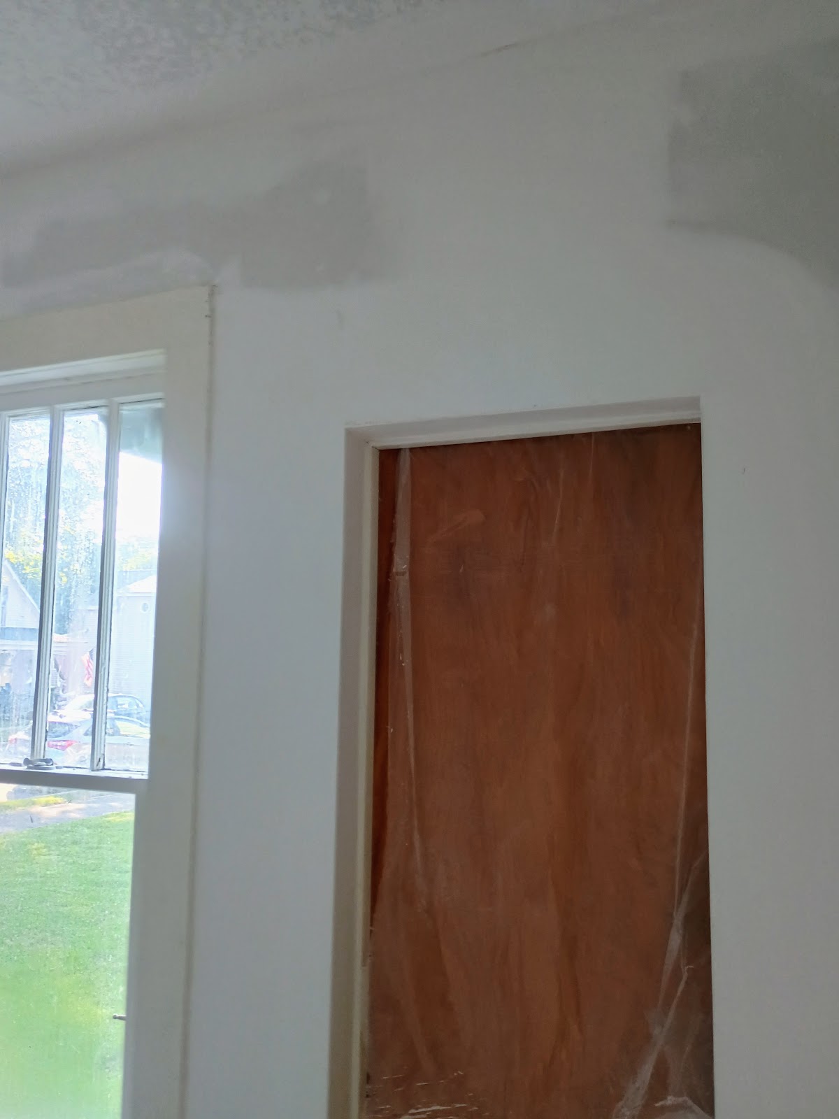 Doorway wall repair — drywall and painting by Smooth Finish, Fort Wayne